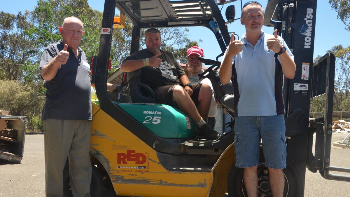 UPLIFTING: Armidale Central Rotary member Ken Gilbert with Ascent workers Adam Barwick, Terry Frost and Matthew Goodman.