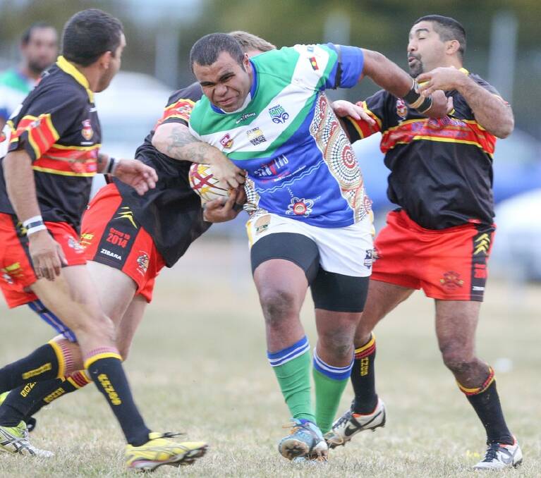BURSTING THROUGH: Armidale Rams front rower Josua Koroibulu charges into the Moree Boomerangs defence last season. Both the Rams and the Boomerangs will line up in the Armidale Ex-Services Nines.