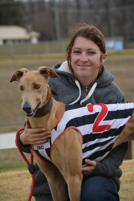 A DOG’S LIFE: Kayla Ollerton and Gary Streetfield’s Everton Boy celebrate a win at the racecourse. 