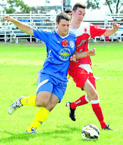 PUSH AND SHOVE: North Armidale’s Jacob Ginzborg tussles with a Moree player last weekend. Photo courtesy Moree Champion.