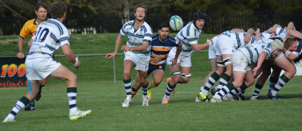 SENDING IT WIDE: Joe Melino flings a pass out to the backs for Robb College against the Blues.
