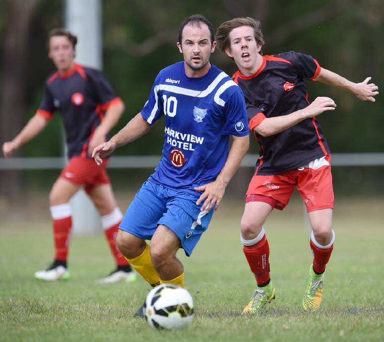 RACE TO THE BALL: Brendan Pinchman in action for North Armidale. Photo Northern Daily Leader.