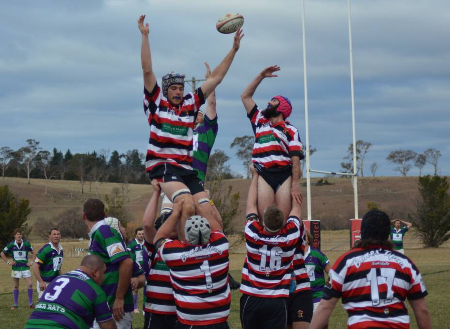 GETTING A LIFT: Cody Graham goes up in a lineout last weekend for Barbarians second grade.