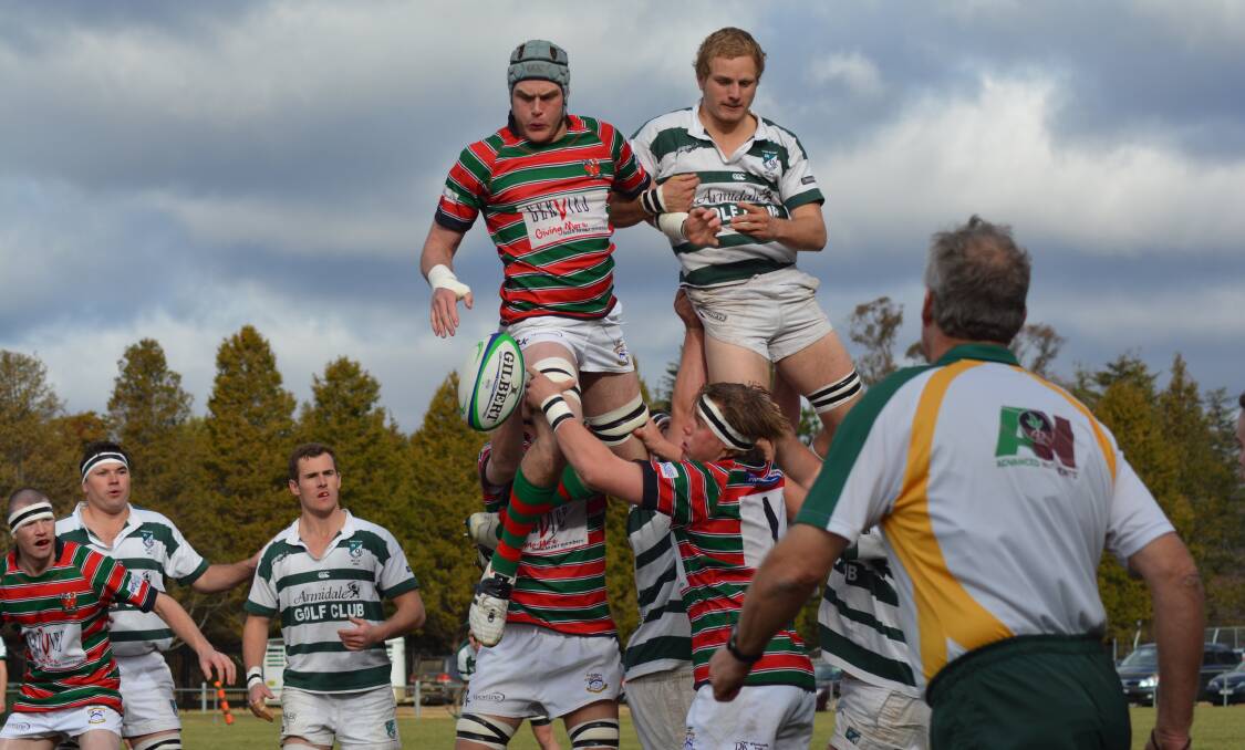 LINEOUT WIN: Olly Bartlett gets posession for St Alberts to the displeasure of Robb College’s Tom Kent on Saturday.