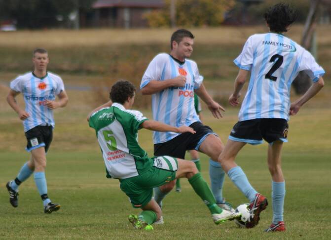 SLIDING IN: Justin Northam puts his body on the line for East Armidale at Doody Park on Saturday.