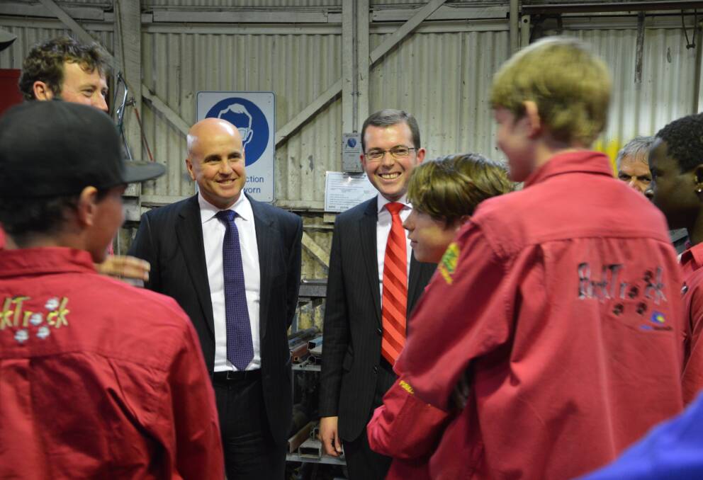 SPACE FOR LEARNING: BackTrack manager and founder Bernie Shakeshaft, Education Minister Adrian Piccoli and Northern Tablelands MP Adam Marshall talking with a group of students taking part in the program.