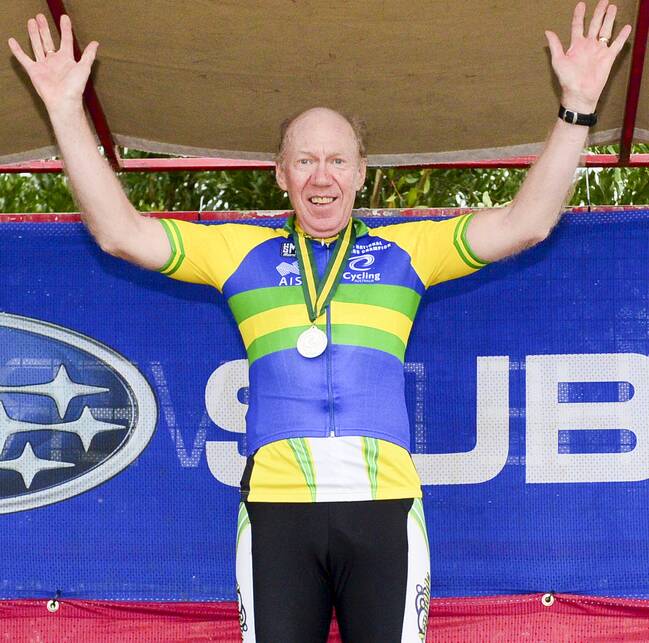 ON TOP OF THE PODIUM: Col Maciver celebrates his win in the overall division champion in the 70 to 74 year age group at the nationals championships.