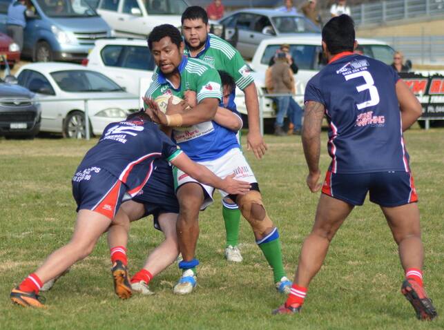 HANDFUL: Apakuki Mate runs into the Ashford Roosters’ defence in a match from last month.