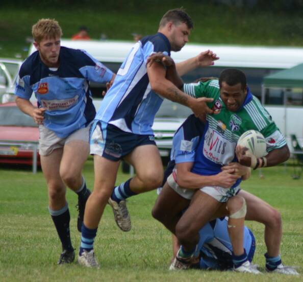 HARD TO HANDLE: Armidale’s Semi Rarawa charges into the Moree Boars’ defence during the inaugural Armidale Ex-Services Nines competition earlier this year.