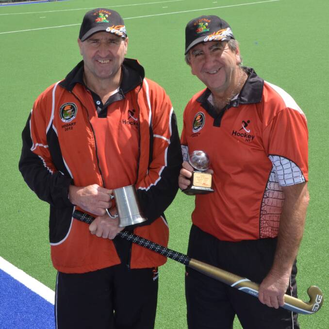 TOP GONGS: Barry Marshall and Neil Clayton display their awards won at the championships.
