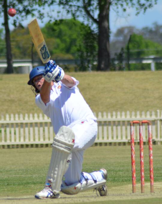 LEADING FROM THE FRONT: Brad King goes up and over during his knock.