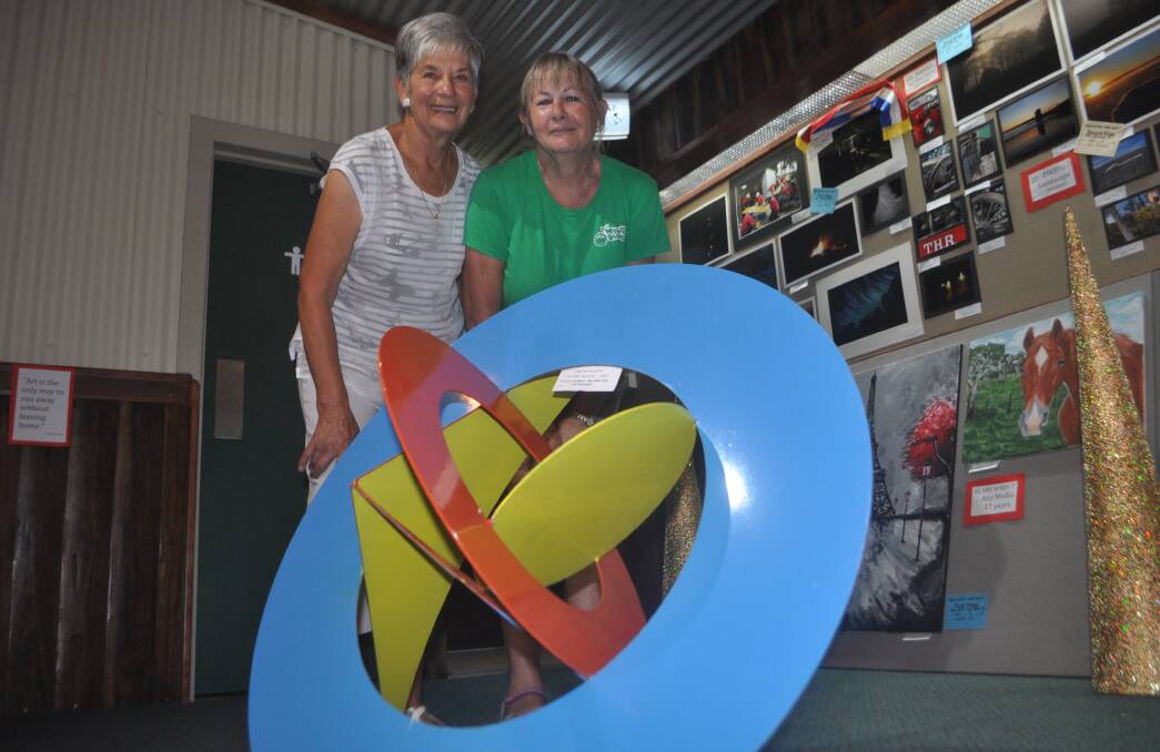 FULL CIRCLE: Rae Andrews and Sally Eades were on-hand to prepare for tomorrow’s Uralla District Show, checking out the bold entries in the fine arts section.