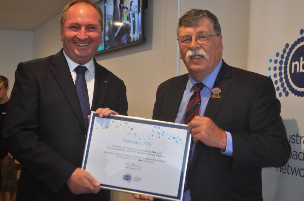 MISSION ACCOMPLISHED: Federal member for New England Barnaby Joyce and Armidale Dumaresq Mayor Herman Beyersdorf are presented with a certificate of completion.