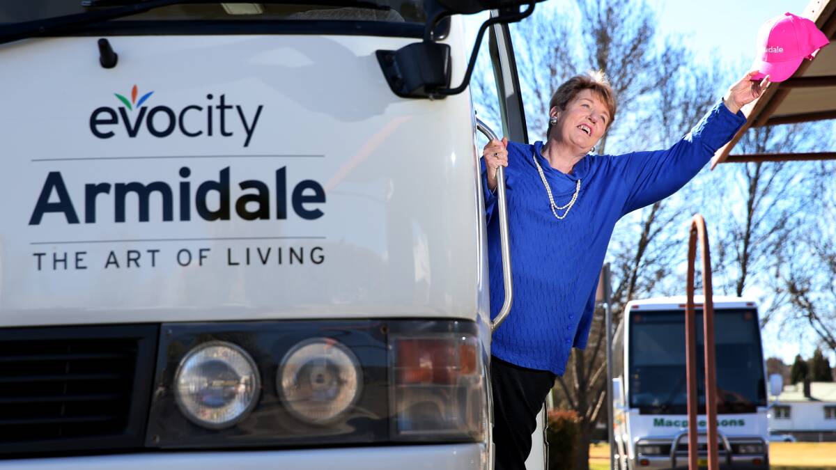 ALL ABOARD: Armidale Dumaresq deputy mayor Jenny Bailey touts for passengers on the bus to be used for the free tours. 
