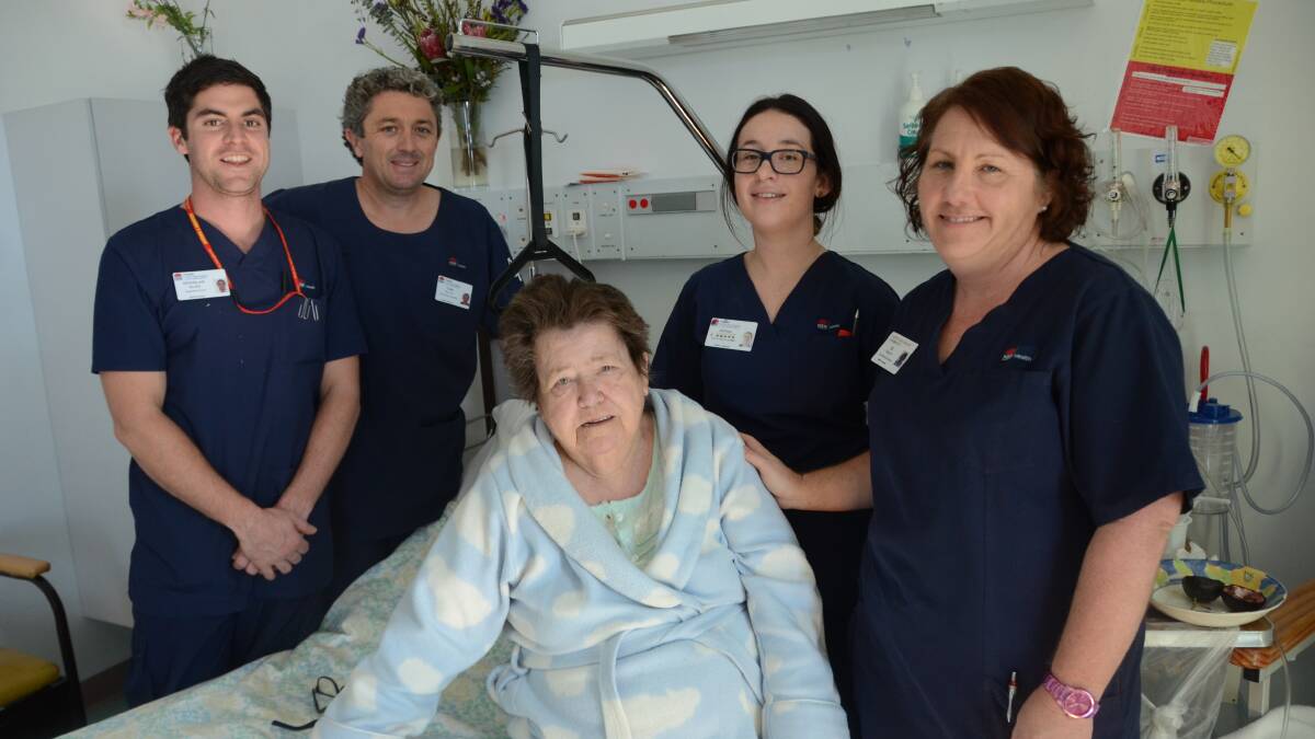 COMFORT: Douglas Billing, Todd Naylor, Ashlee Creighton, patient Dawn Cuttmore and Di Targett with one of the new hospital beds.