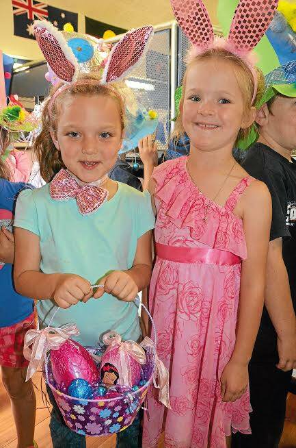 GUNNEDAH: Gunnedah South Public School pupils Imogen Riley, left, and Aleisha Doolan are ready for their Easter Hat Parade. - The Namoi Valley Independent