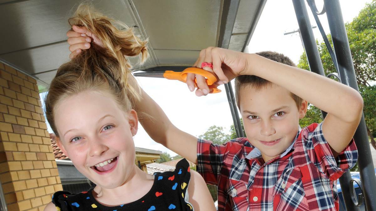 GETTING THE CHOP: Ella Clout, 10, is gearing up to have her long locks cut off next month in the name of charity. Pictured here with younger brother, Riley, 8. Photo: Gareth Gardner 160414GGB02 - The Northern Daily Leader.