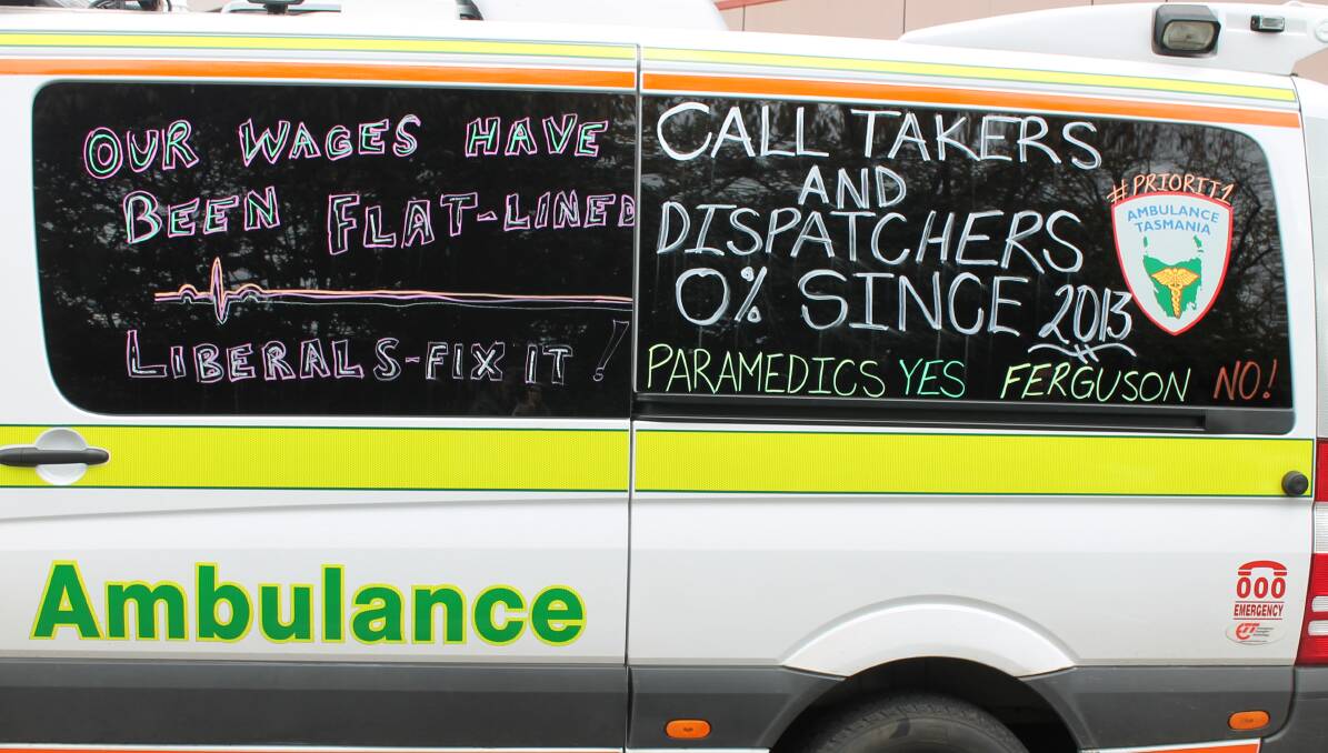 Message for the boss: Paramedics and ambulance workers are writing signs in chalk on the sides of their vehicles. Picture: Alistair Finlay