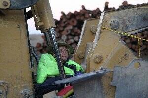 I’M IN CHAINS: Armidale’s Carmel Flint attaches herself to a bulldozer in the Leard 