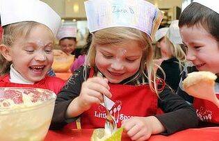 Kitchen kids... five-year-olds Emily Poly-Jones, Zara Durand and William Manny at Little Spoons cooking school. Photo: Adam Hollingworth