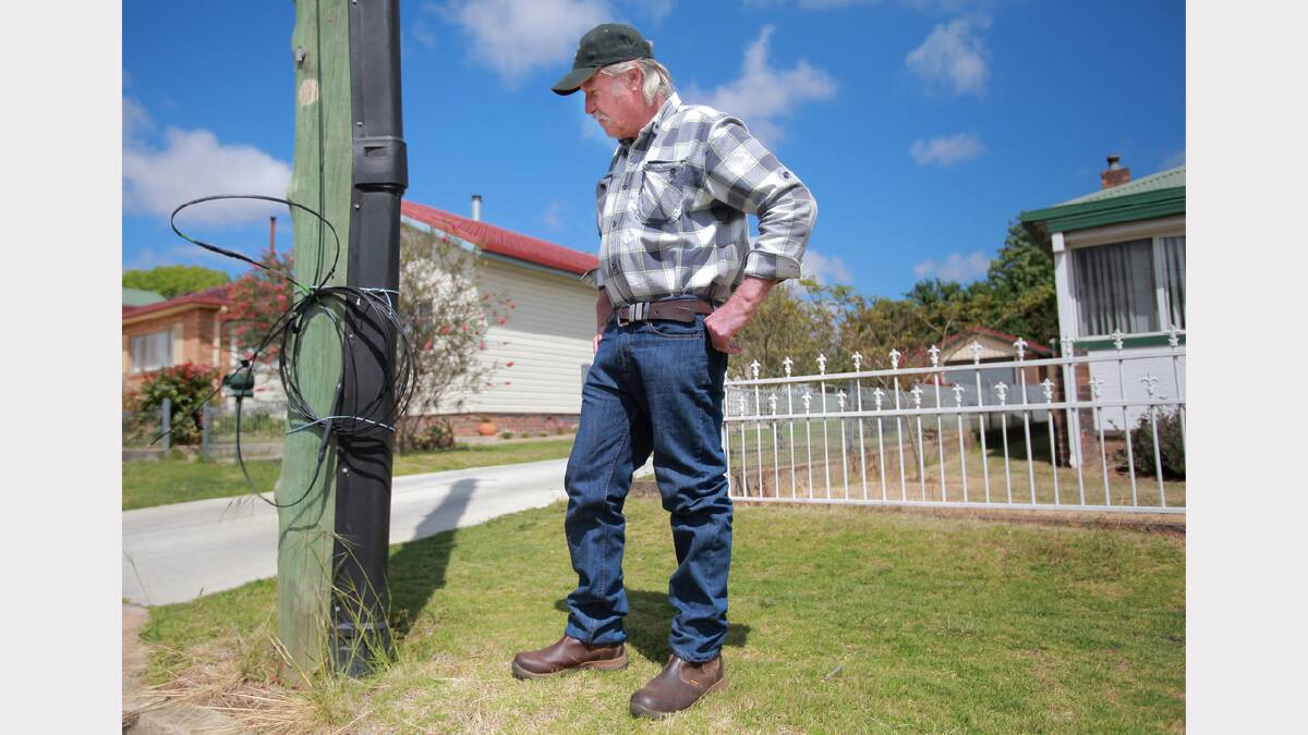 SAFETY FIX: Resident Brian Parsons had to secure the felled NBN cable himself and fix it with twine.