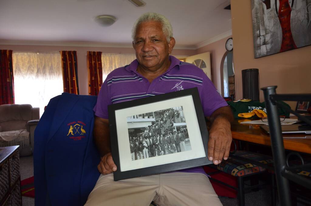 PROUD: Bill Widders was part of the first Australian Aboriginal team that travelled to New Zealand in 1973. He is pictured with a team photo and the blazer he wore on tour. The Aboriginal team will be finally recognised by the NRL this weekend.