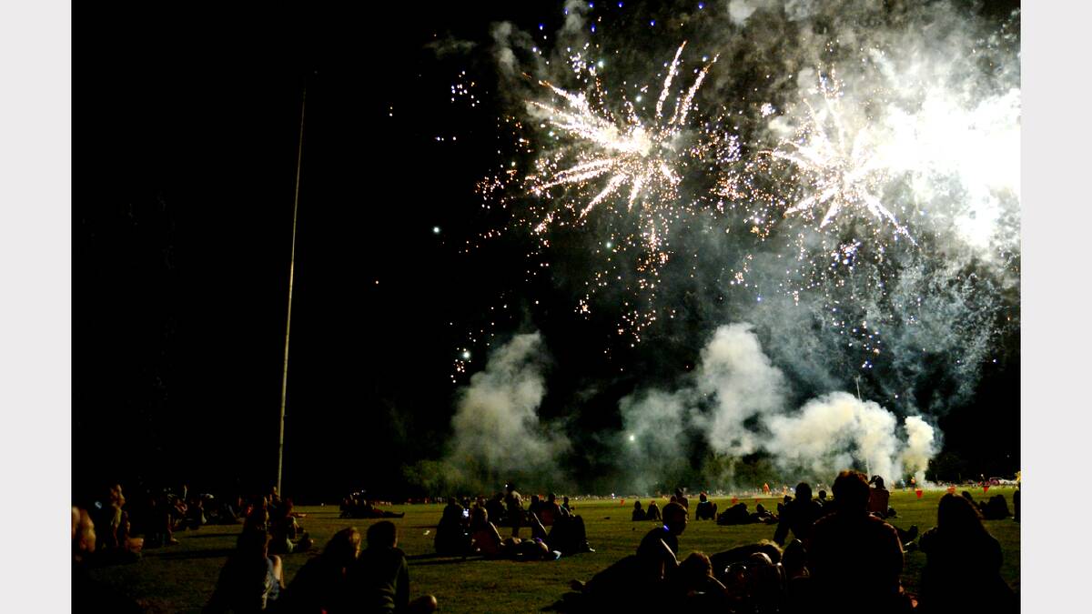 LIT UP: The crowds gazed skywards as the pyrotechnics brought colour to the darkness. Photo by GRANT ROBERTSON