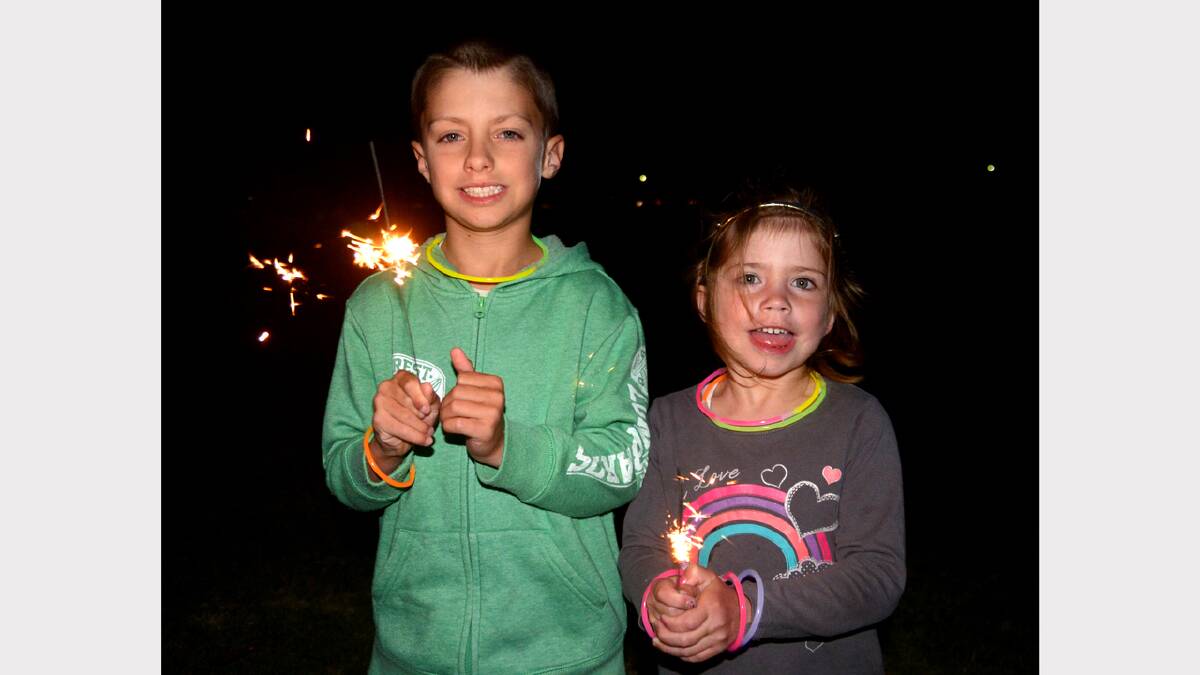 SPARKLING SIBLINGS: Armidale's Justin, 8 and Taylah O'Malley, 4, brought some spark to New Year's Eve. Photo by GRANT ROBERTSON