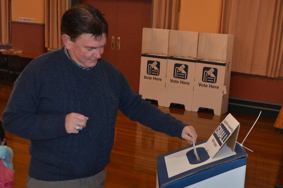Jim Maher casts his vote.