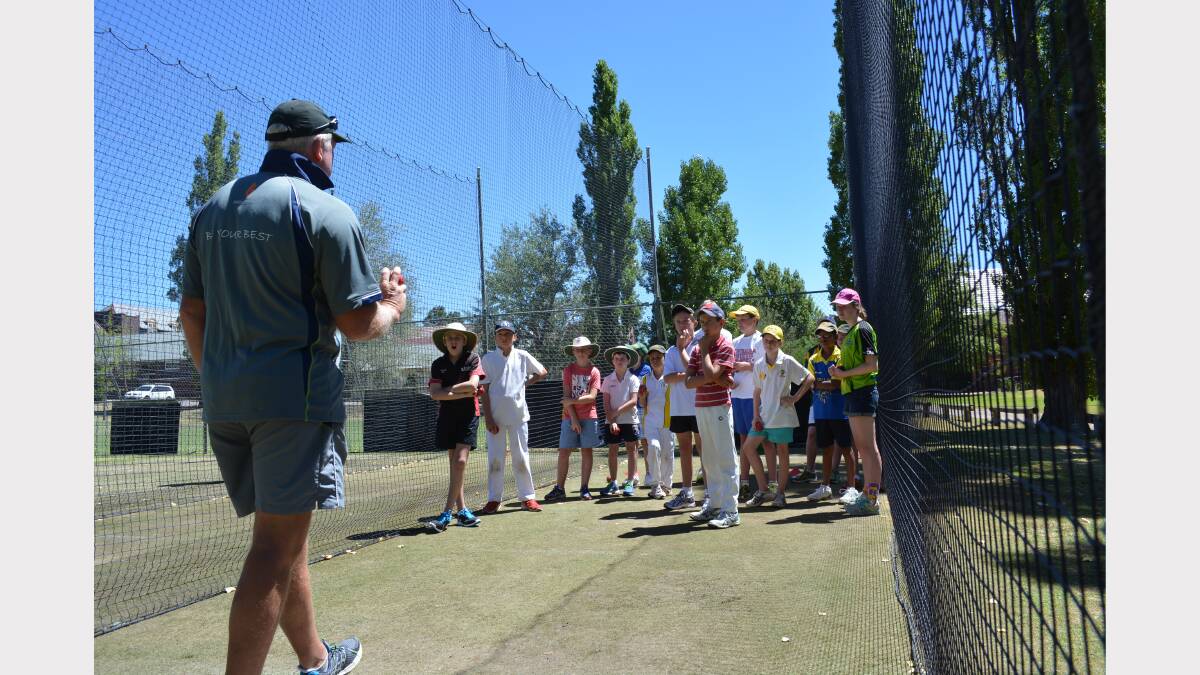 Austalian bowling coach Craig McDermott demonstrates at a cricket camp.