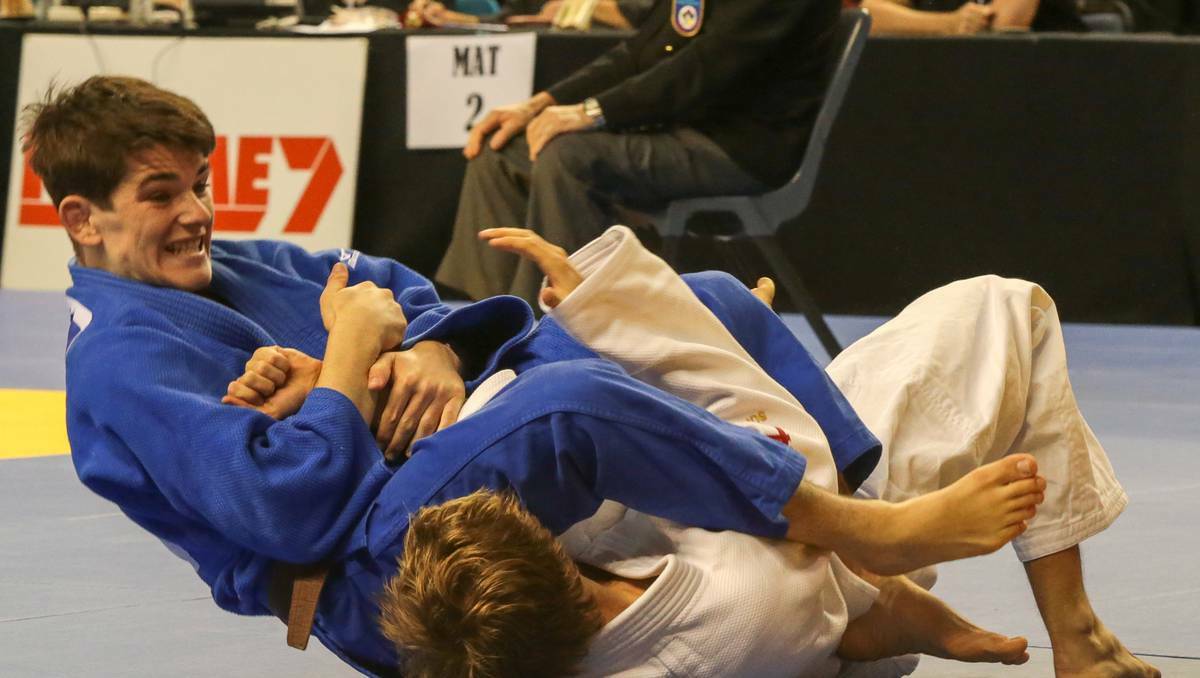 Harry Cauley (white) battles with Josh Katz in the Judo National Championships. Pictures: Adam McLean, Illawarra Mercury