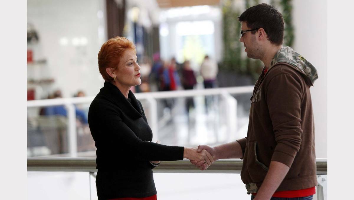Pauline Hanson on the campaign trail in Charlestown Square on Thursday. Pauline chats with Marden Wark of Newcastle. Picture Darren Pateman, Newcastle Herald