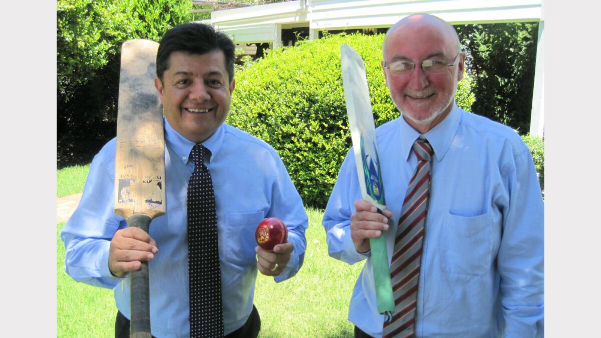 SWING AWAY: Richard Torbay with University of New England Vice-Chancellor Jim Barber in 2011. 