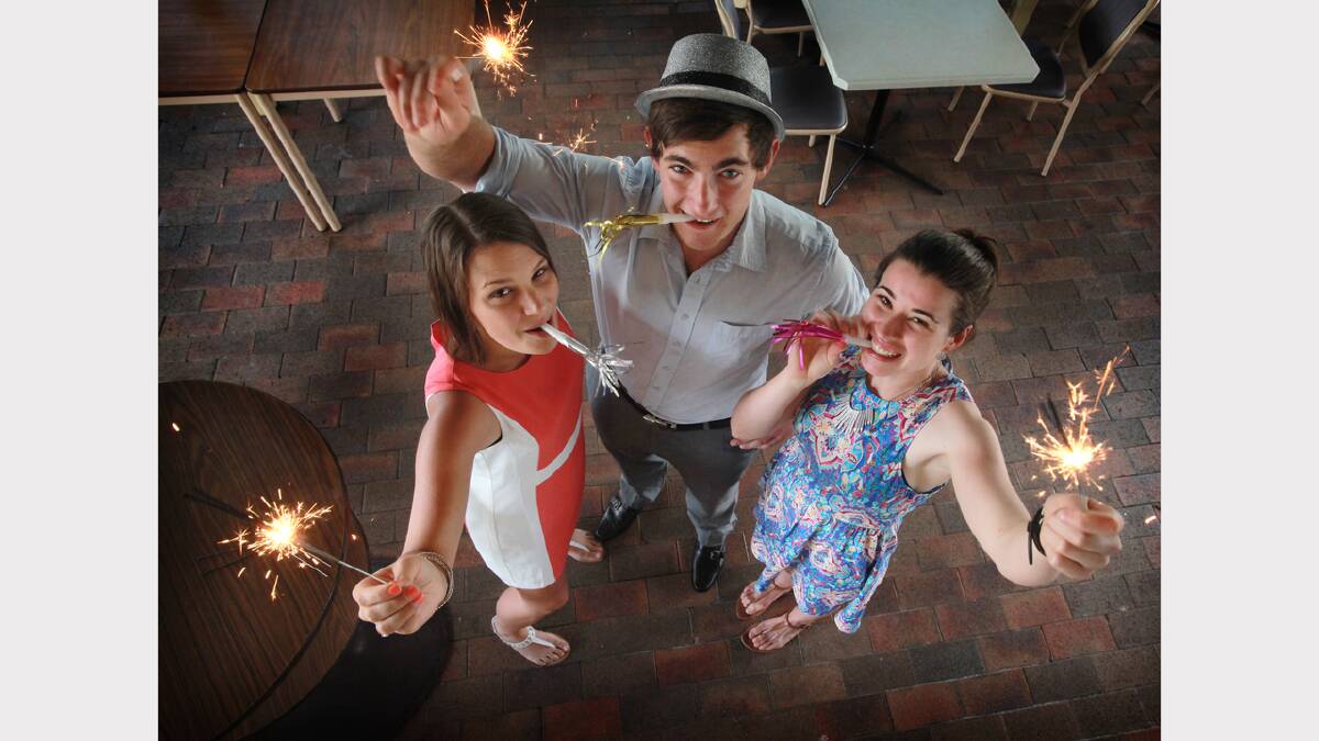HAPPY NEW YEAR: Tahliea Merchant, Stephen Tanner and Chloe Reeves helped bring in 2014 at a big New Year’s Eve entertainment feast at the Armidale City Bowling Club.