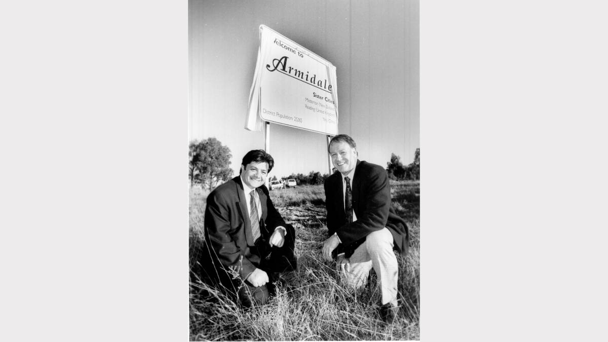 OBVIOUS SIGNS: Richard Torbay, then mayor of Armidale in front of one of the city's road signs with Dumaresq mayor Peter Monley in 1998 