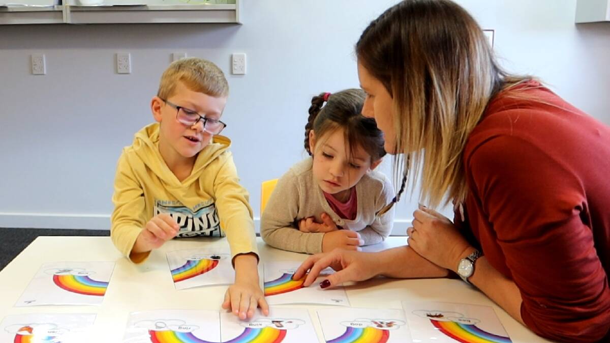 SOUND AWARENESS KEY: Jed and Erin Eather work on their rhyming with the help of Sandie Davis. PHOTO: Supplied