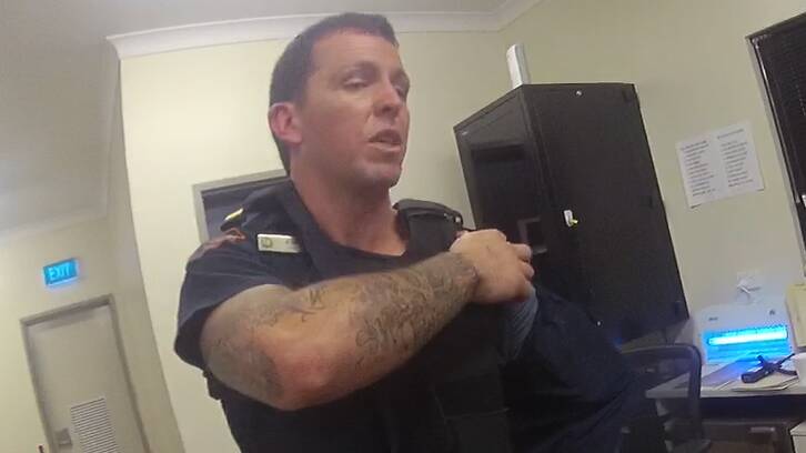 Mr Rolfe shows other officers his injury in the Yuendumu police station after the shooting. Picture: Supreme Court of the Northern Territory. 
