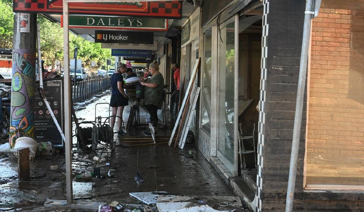 Flood water swept through the NSW northern rivers town of Lismore, leaving a path of destruction, as seen here on Keen St. Photo: Cathy Adams