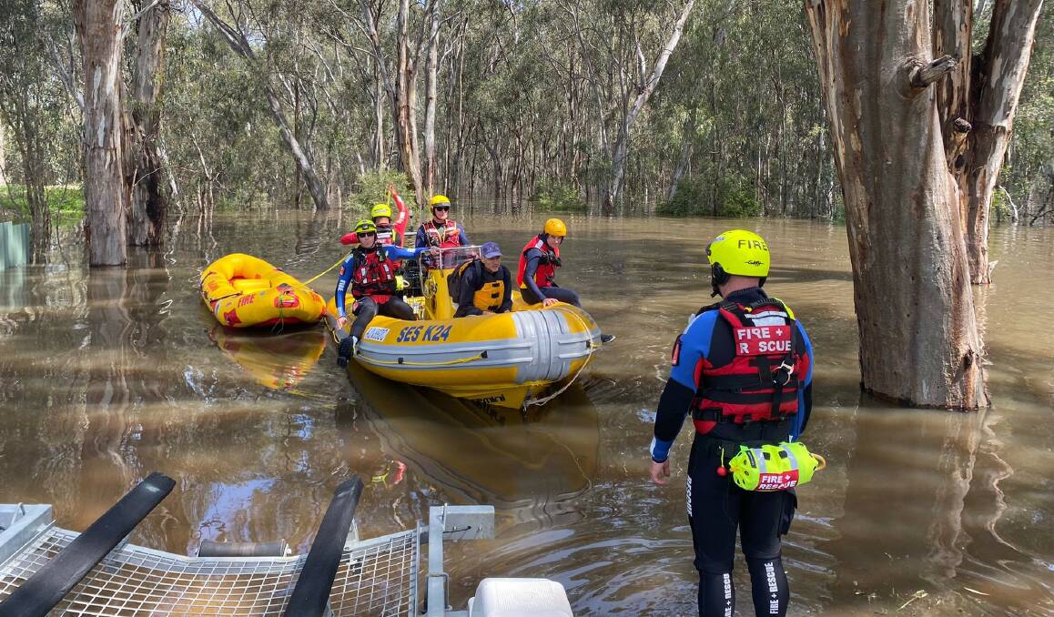 NSW emergency services had to rescue a man, his dog and half a dozen chickens from a Moama property along the Murray River on Monday. Picture by Fire and Rescue NSW
