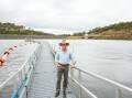 Dam Designs: Member for the Northern Tablelands, Adam Marshall, inspects the dam wall, which will be raised over six metres. Photo: Supplied.