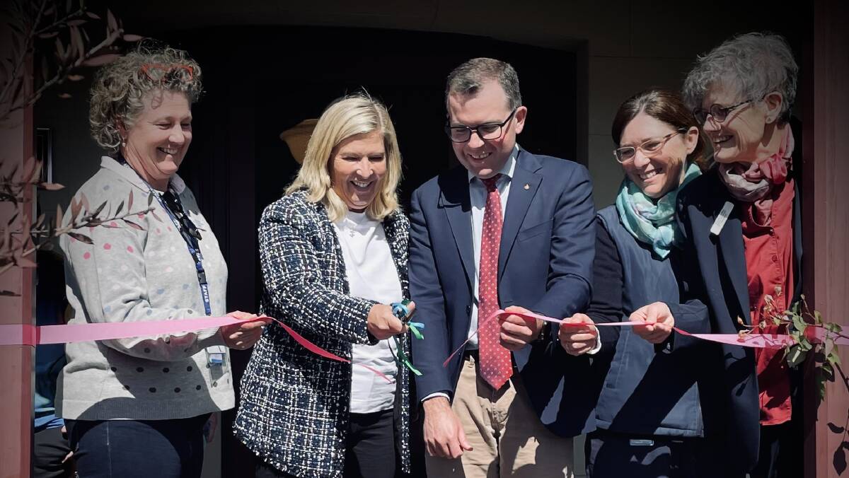 Minister for Regional Health Bronnie Taylor cuts the honorary pink ribbon alongside MP Adam Marshall and nursing staff to signify the official opening of the Tresillian Centre in Armidale. [Image: Rachel Gray]