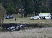 Emergency services at the scene of a fatal light plane crash north of Canberra which killed three children from Armidale. Picture supplied by Lukas Coch for AAP PHOTOS