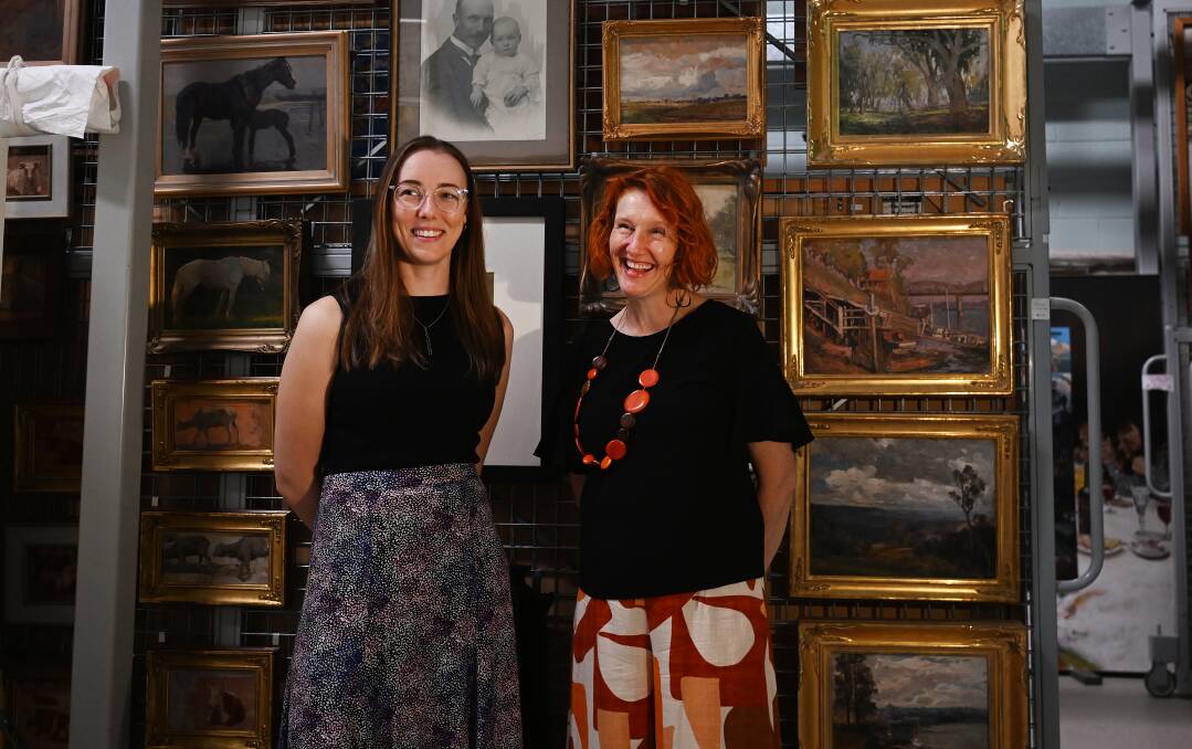 Tamworth Regional Gallery's Mia Roman and Bridget Guthrie are excited to showcase artworks from the gallery's 100-year-old collection. Picture by Gareth Gardner