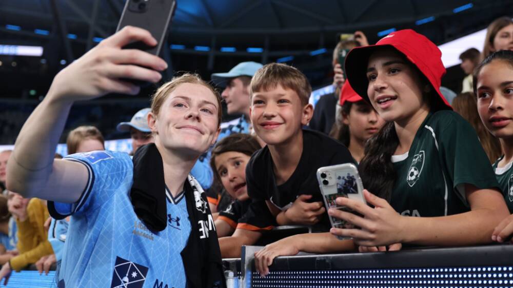 Sydney FC and Matildas star Cortnee Vine takes selfies with young fans after the round one match at Allianz Stadium on October 14. Picture by @sydneyfootballclub on Instagram