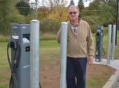 Uralla Bowlo director Bob Crouch standing near the two electric vehicle chargers the club has secured. Photo Heath Forsyth 