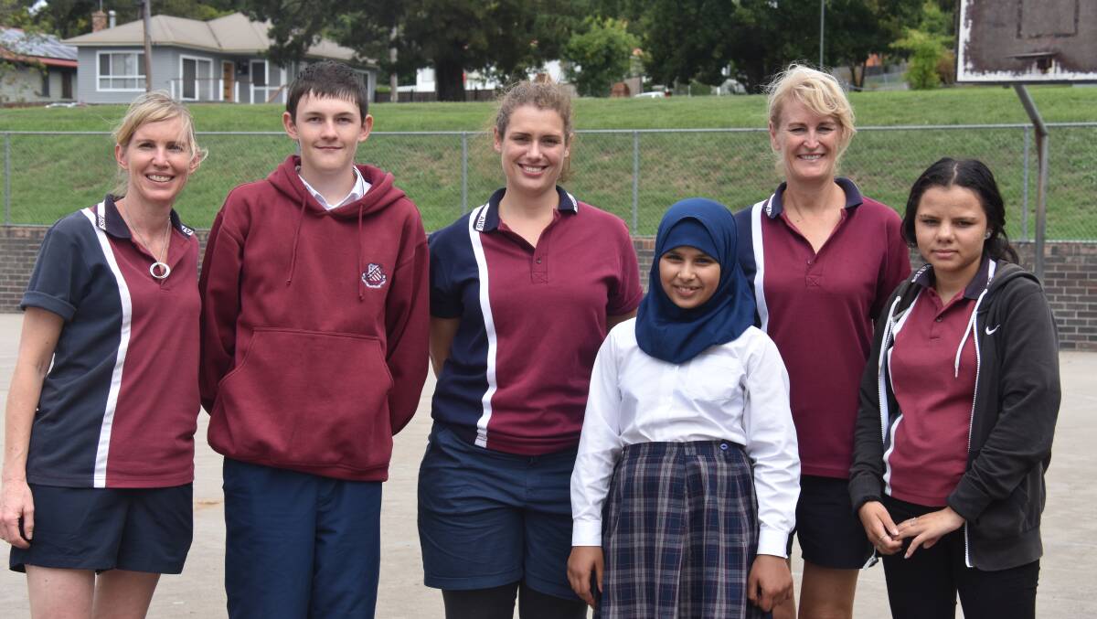 SWAP: Armidale High's Carolyn Lupton, Trent Edwards, Fiona Smee, Fatimah Almoadhen with Annette Callister and Mareena Ahoy on Monday.