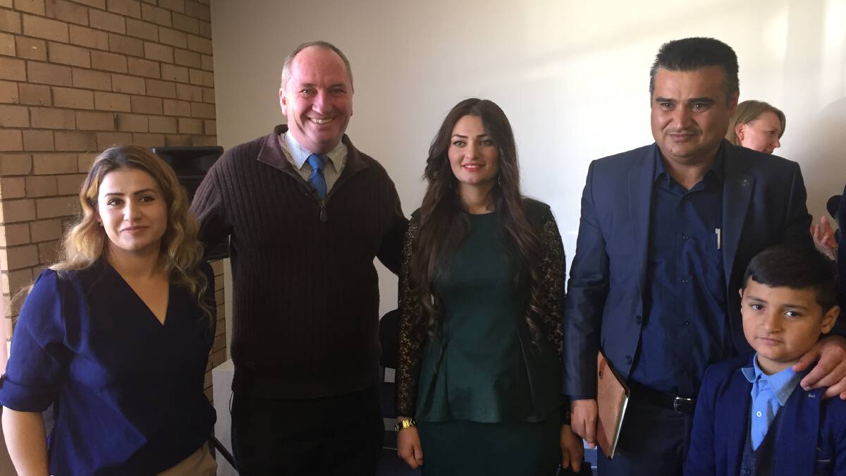 WELCOME: New England MP Barnaby Joyce with Hussein family at the opening of Armidale's Settlement Services International office.
