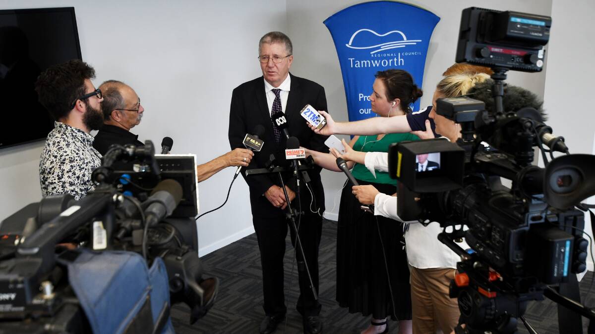 DISAPPOINTED: Tamworth mayor Col Murray addresses the media moments after stepping off a plane. Photo: Gareth Gardner