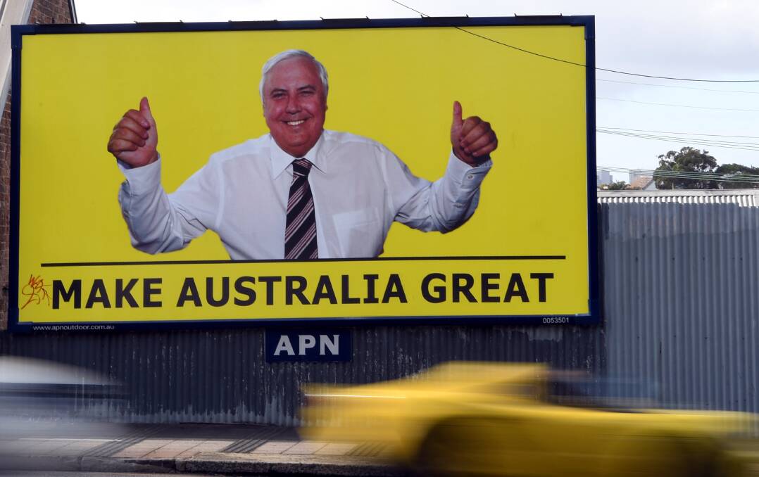 Yellow billboards featuring controversial businessman Clive Palmer and the slogan “Make Australia Great” have been spotted across the electorate. 