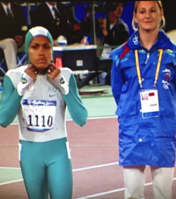 Act natural: Olympian Cathy Freeman prior to her 400m run with 17-year-old Rachel Delphin next to her. Picture: supplied